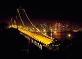 The Bay Bridge and San Francisco lit up during the holiday season.