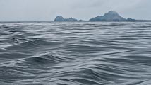 On this gloomy, overcast day the ocean emulates the shapes of the Farallon Islands off the coast of San Francisco.