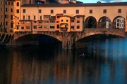 The famous Ponte Vecchio is a bustling marketplace during the day, but first thing in the morning the sculler was all that was moving.