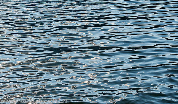 The water around the boat was constantly changing. At this moment it was reflecting the sky and clouds, making mesmerizing patterns to get lost in.