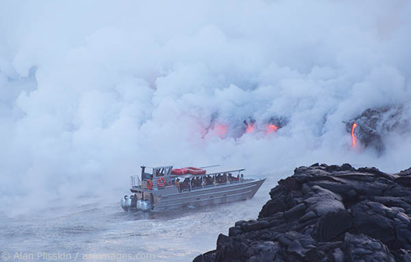 A 4.5 mile hike led to a viewpoint overlooking lava from Mauna Loa flowing into the ocean. A boat got close to the lava flows dropping down 30 foot cliffs. Two weeks later, 24 acres of newly formed land fell into the ocean including the very spot I was standing here.