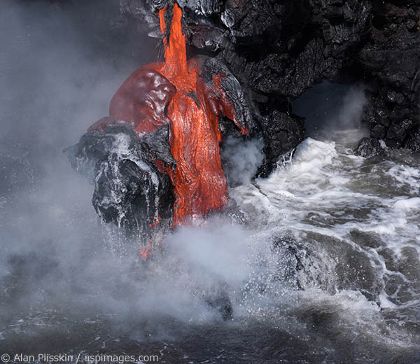 On a boat we got close enough to the lava flow that I could feel the heat it emitted.  You can see the different stages of hardening of the lava all in this one flow.