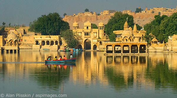 Colorful boat crosses Lake Gadsar near Jasailmar.