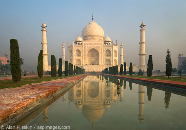 The Taj Mahal has a faint glow at dawn.