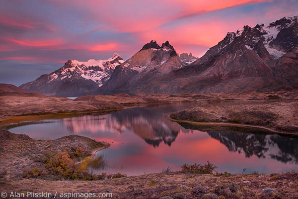 On our last sunrise in Torres del Paine, Chile we were fortunate enough to have some beautiful light.  The clouds changed from grey to pink to orange to yellow over this small lake.